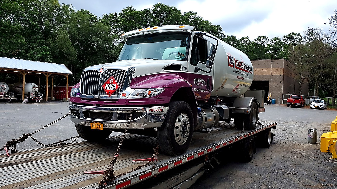 Propane truck transported on flatbed