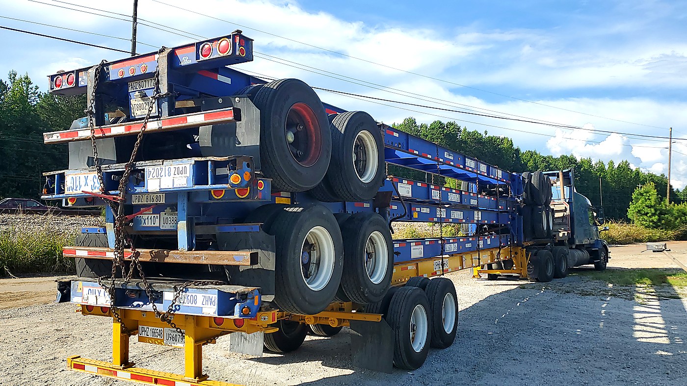 Stacked flatbed trailers haul